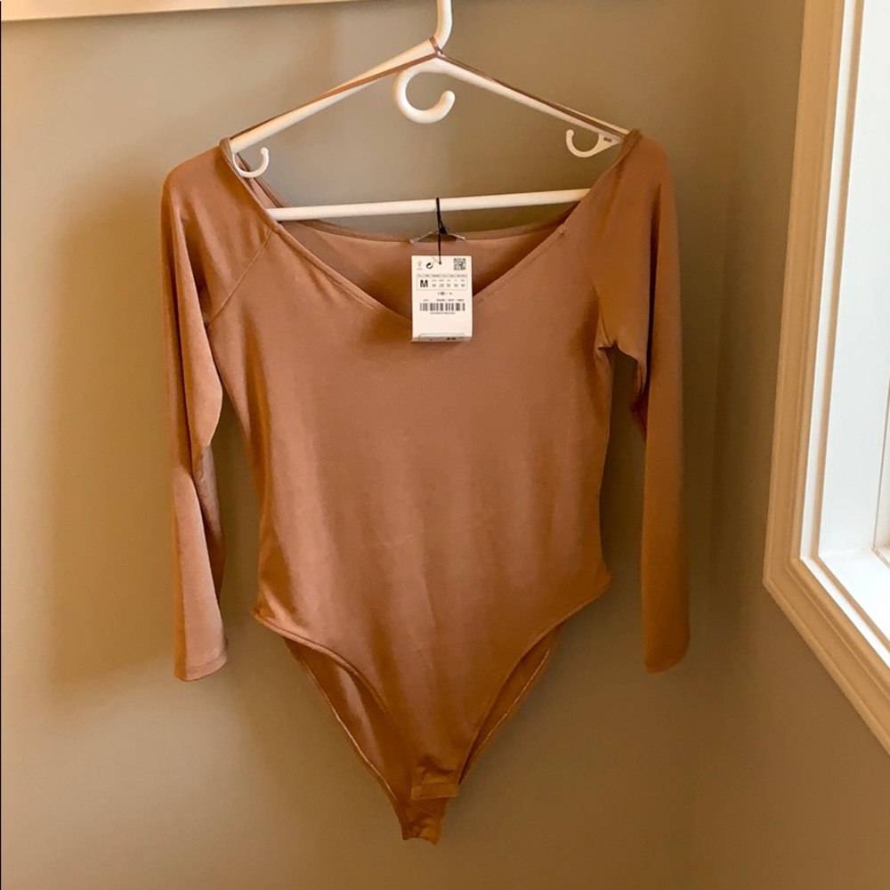 Rose Gold body suit size M